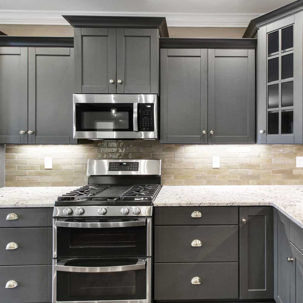 kitchen with black cabinets and a gas stove